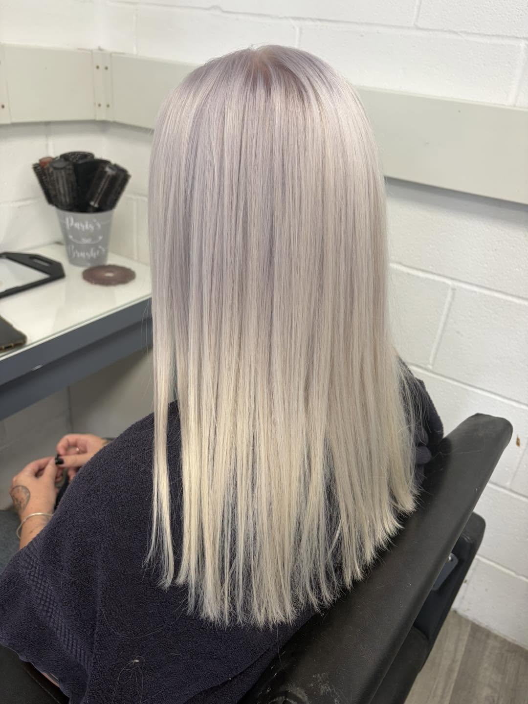 Glossy blonde hair finish by Hair By Paris